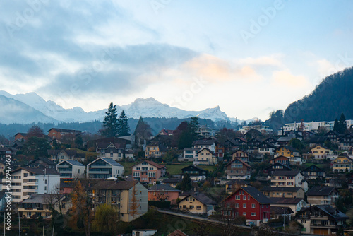 Nice scape of Thun city and Mt.Niesen from Spiez Castle and Tower on the hills near Lake Thun during autumn , winter morning : Spiez , Switzerland : December 4 , 2019