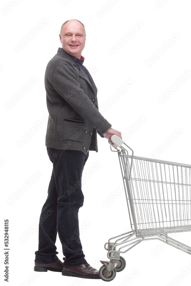 smiling casual man with shopping cart .isolated on a white background. smiling casual man with shopping cart .isolated on a white background.