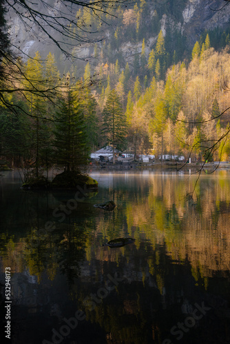 Blausee , beautiful turquoise nature lake in Bernese Oberland, Kandergrund during autumn , winter morning : Blausee , Switzerland : December 4 , 2019