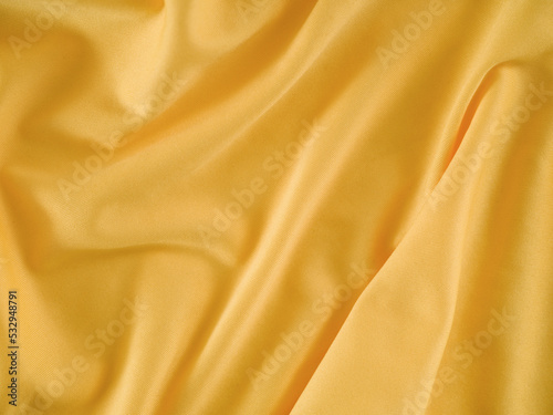A crumpled gold fabric background