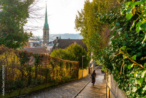 Pleasant street near ETH Zurich Hauptgebaude , university and observation desk in Zurich during autumn , winter cloudy day : Zurich , Switzerland : December 6 , 2019 photo