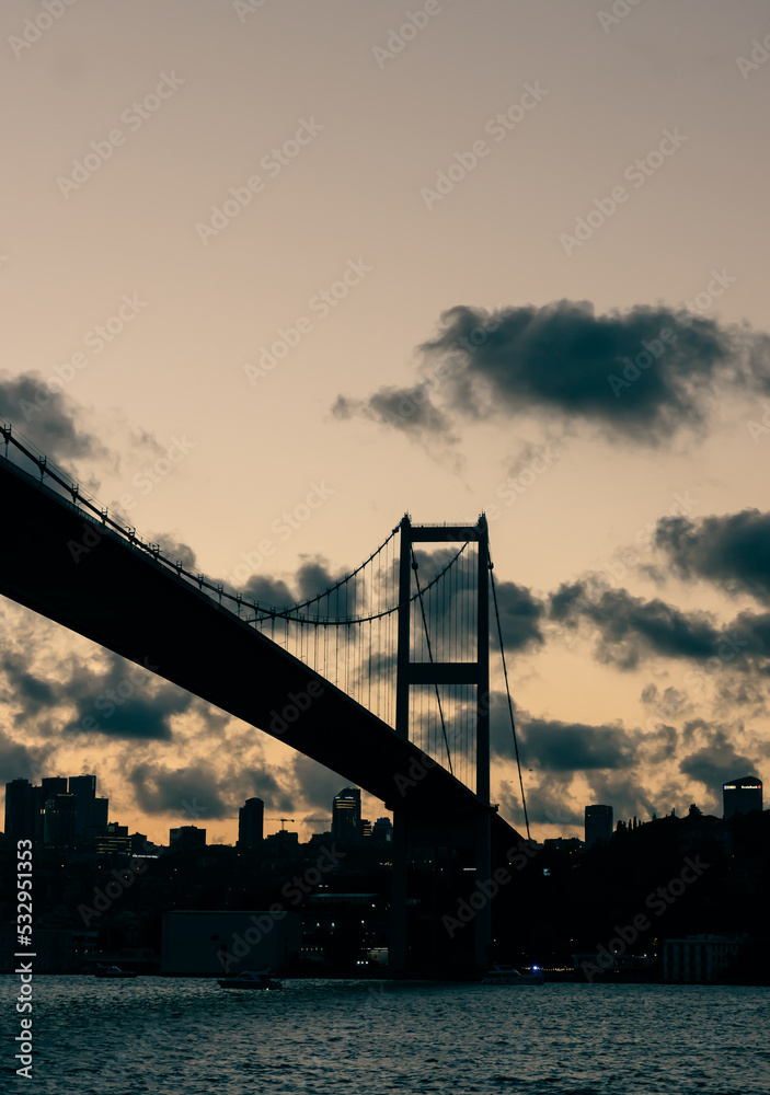 Sunset on the bosphorus bridge in istanbul with clouds
