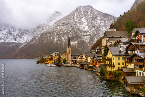 Panoramic classic view at Hallstatt , Unesco Romance town at Lake Hallstatt and Salzkammergut during winter cloudy day : Hallstatt , Austria : December 10 , 2019