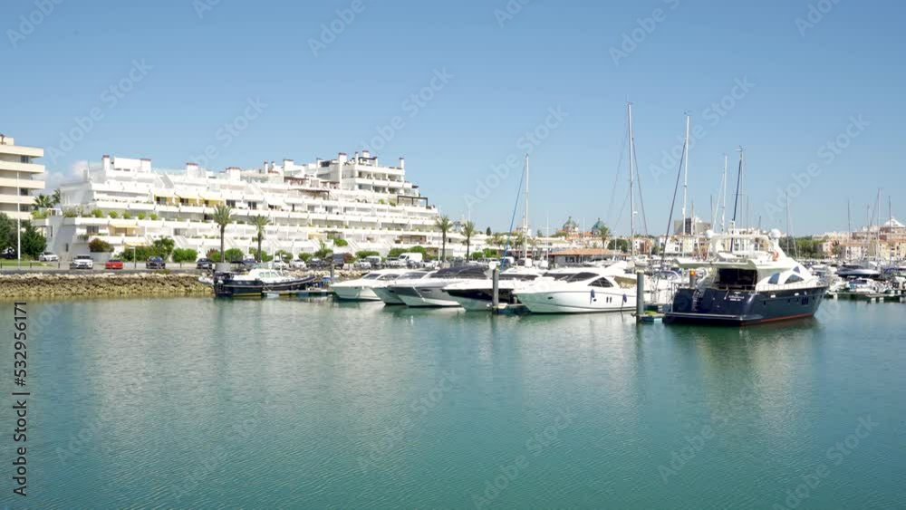 Vilamoura, PORTUGAL: September 18 2022: View of luxury port of Vilamoura, Algarve. Luxury travel destination in South of Portugal. Yacht docked, restaurants, luxury hotels, urbanisations. Static video Vilamoura, PORTUGAL: September 18 2022: View of luxury port of Vilamoura, Algarve. Luxury travel destination in South of Portugal. Yacht docked, restaurants, luxury hotels, urbanisations. Static video