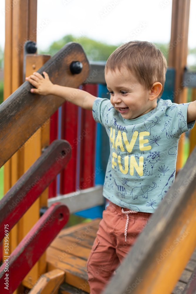Little boy playing at the playground Little boy playing at the playground