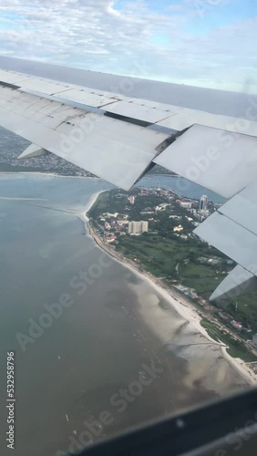 View from the window seat of a flight in the air approaching landing