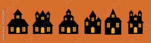 Set of black haunted halloween houses isolated on orange halloween background.
