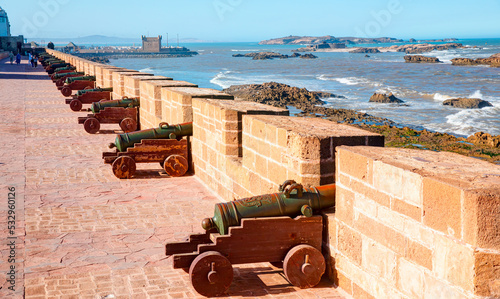 Citywall Scala de la Kasbah with cannons, View to Fortress Scala du Port - Historic city Medina of Essaouira, Morocco photo