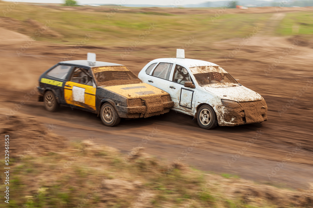 Rally off-road car make a turn with the clouds and splashes of sand, gravel and dust during rally championship