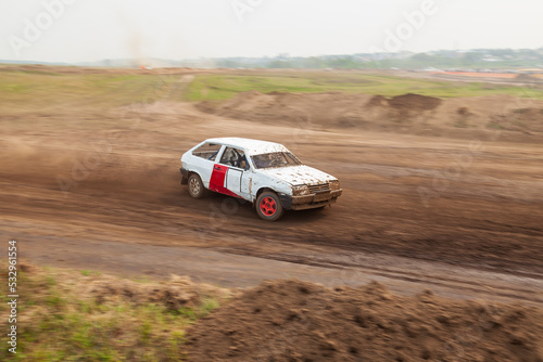 Rally off-road car make a turn with the clouds and splashes of sand, gravel and dust during rally championship © Aleksandr Kondratov