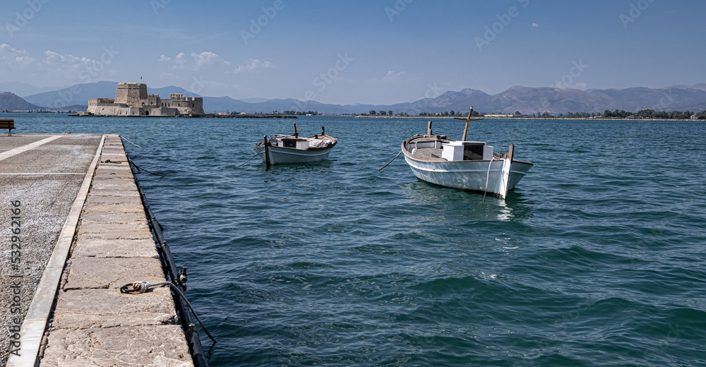 View of the strong and impressive Fortress of Bourtzi as seen from the coast and pier of Nafplio, Argolis, Peloponnese, Greece.