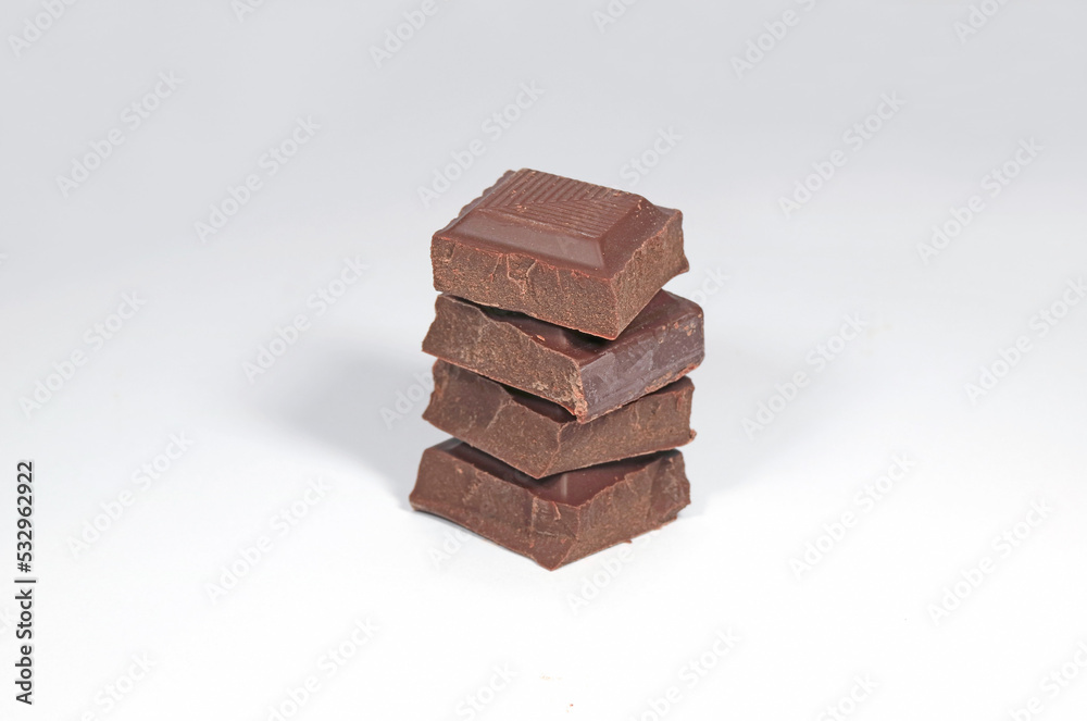 Closeup Stack of Dark Chocolate Chunk Isolated on White Background Closeup Stack of Dark Chocolate Chunk Isolated on White Background