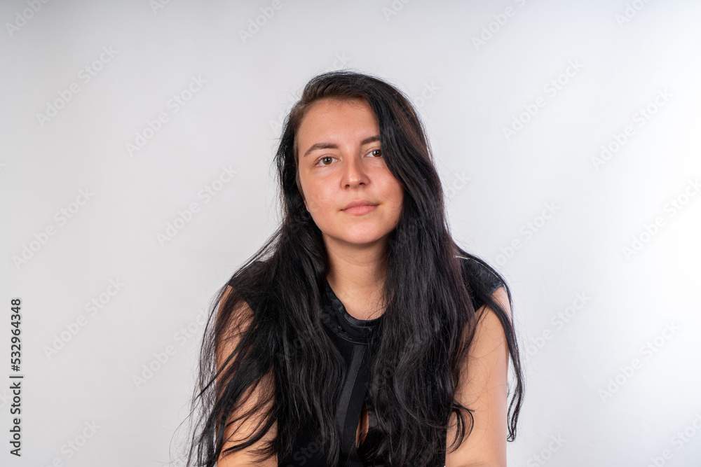 Woman posing on isolated white background, selective focus shot. Woman posing on isolated white background, selective focus shot.
