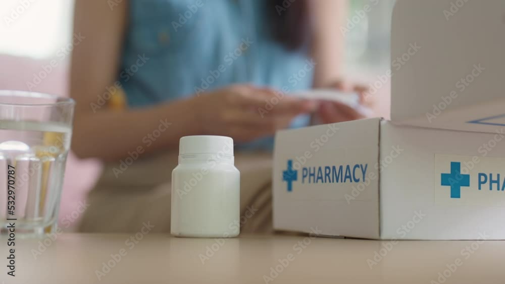 Asia female people smile unbox first aid Rx kit carton box at home sofa