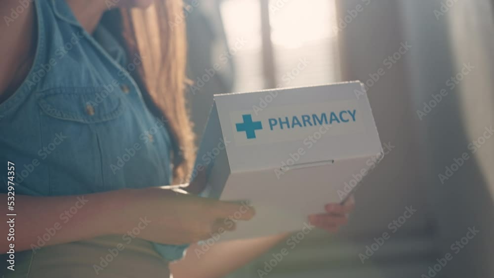 Asia female people smile free help first aid Rx kit carton box at home front door. Clinic drug store send self cure mail post parcel to young woman online health care happy order herbal vitamin postal
