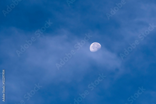 Day Moon Glowing in Blue Sky with White Cloud Overlay