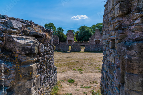 A view through an opeing into the haunted ruins of Grace Dieu Priory in Leicestershire, UK in summertime photo