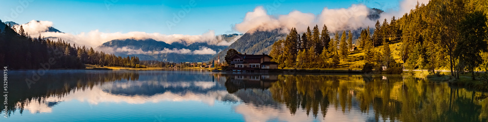 High resolution stitched panorama with reflections at the famous Pillersee lake near Saint Ulrich, Tyrol, Austria