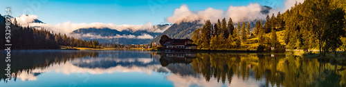 High resolution stitched panorama with reflections at the famous Pillersee lake near Saint Ulrich, Tyrol, Austria © Martin Erdniss