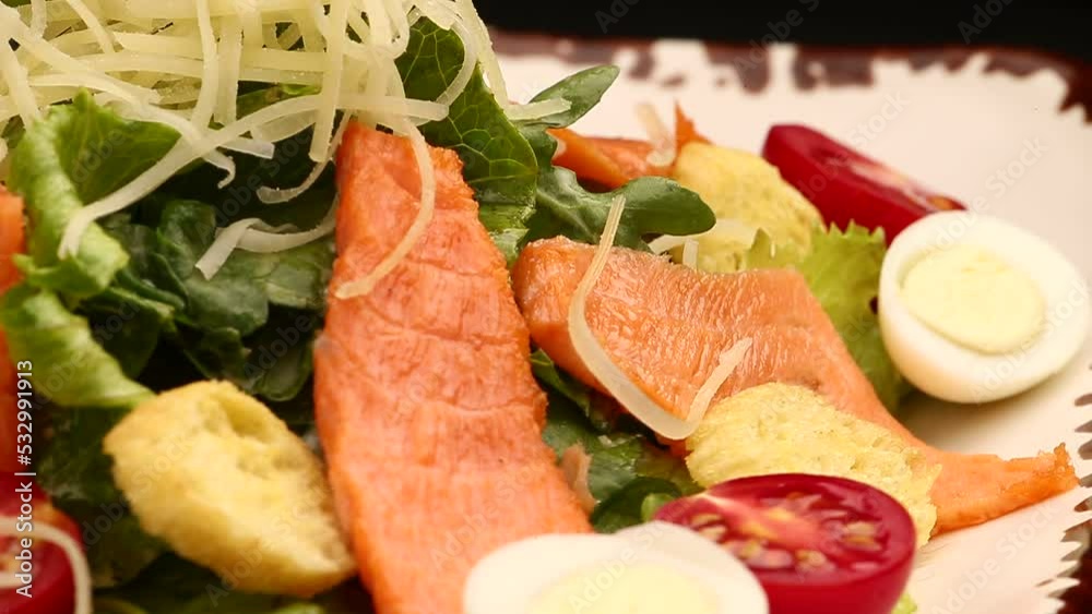 Salad with salmon and tomatoes in a bowl. Selective focus. Salad with salmon and tomatoes in a bowl. Selective focus.