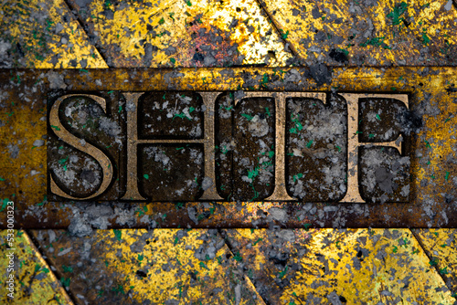 SHTF text with nuclear fallout on grunge textured copper and gold background photo