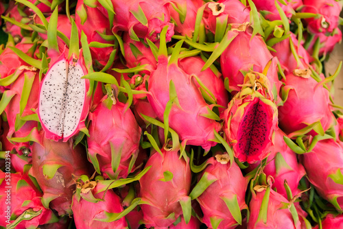 Pile of pitaya or dragon fruit, Big Bunch of Pink Dragon Fruits in traditional Market, Copy space.
