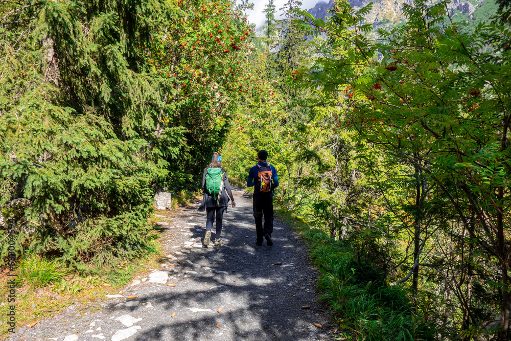 Tourists walk along a mountain trail in the Tatras in Slovakia Tourists walk along a mountain trail in the Tatras in Slovakia