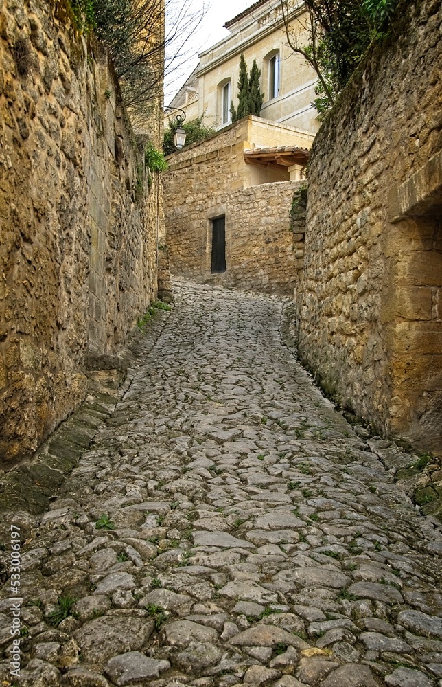 Stones and cobblestones alley in the historic Bordeaux village of St. Emillion, France.