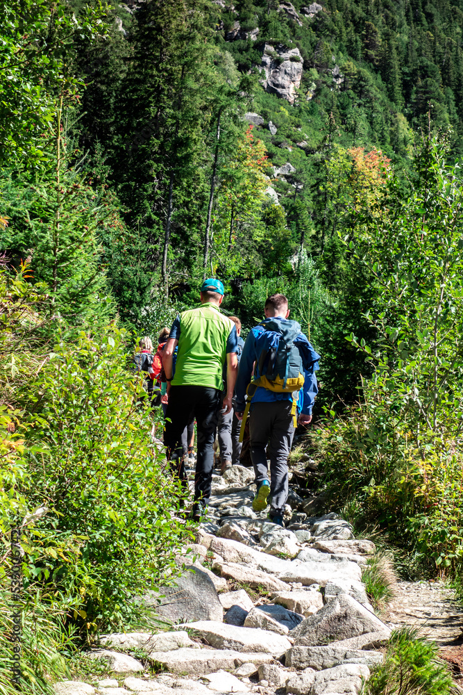 Tourists walk along a mountain trail in the Tatras in Slovakia