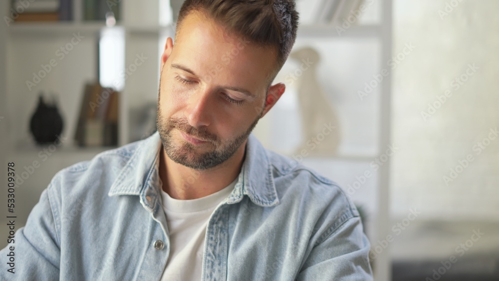 Portrait of young adult man working at home. Concentration, focused on work. Portrait of young adult man working at home. Concentration, focused on work.