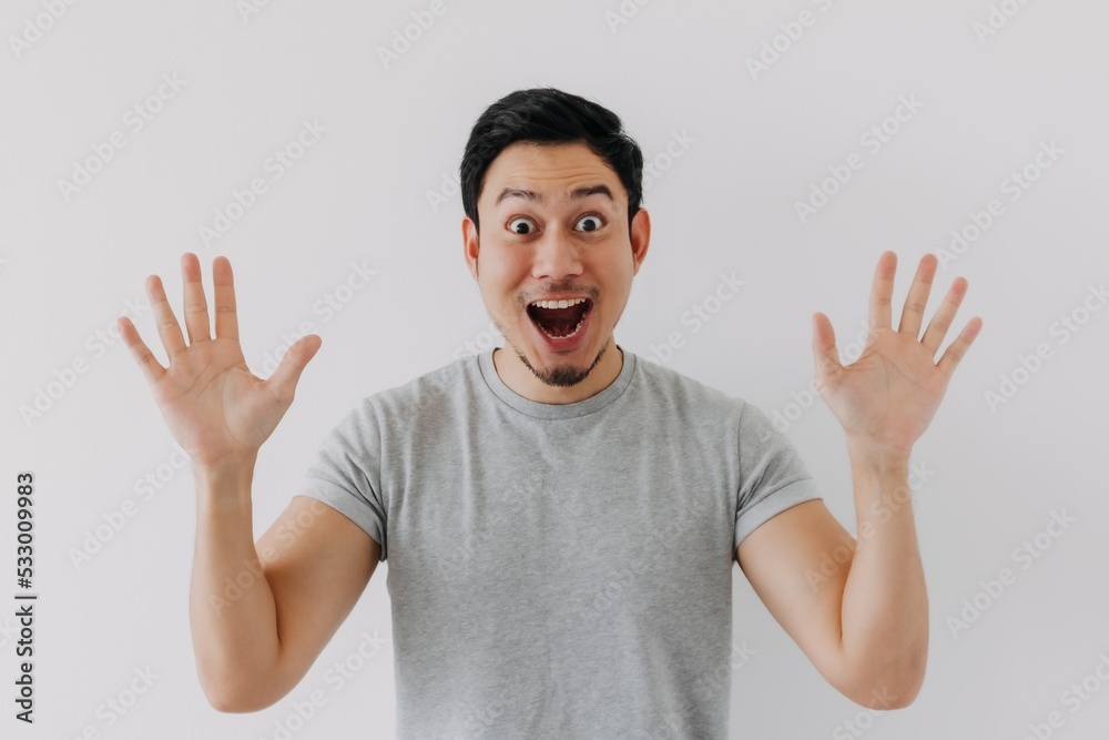 Surprised shocked face asian man isolated on white background for advertisement. Surprised shocked face asian man isolated on white background for advertisement.