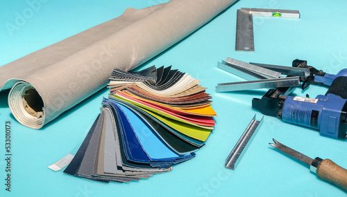 Leatherette roll selected according to samples. Tools used for upholstery and furniture repair