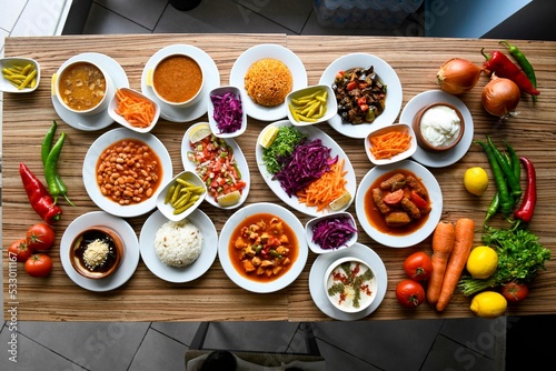 Table scene of assorted take out or delivery foods. Traditional Turkish cuisine. Various Turkish meal and appetizers. Top down view on a table.