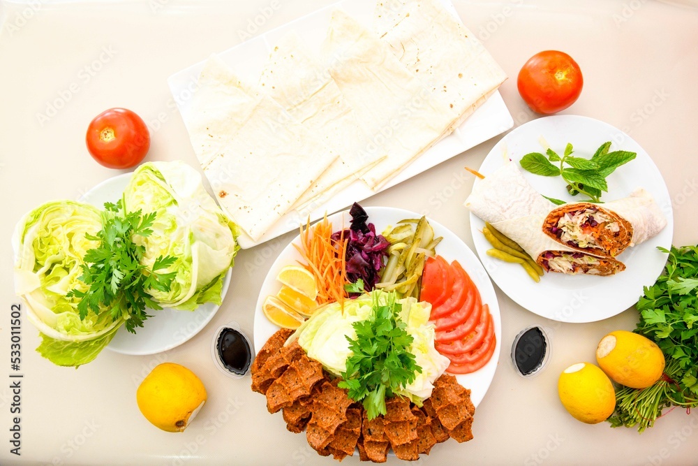 Table scene of assorted take out or delivery foods. Traditional Turkish cuisine. Various Turkish meal and appetizers. Top down view on a table.