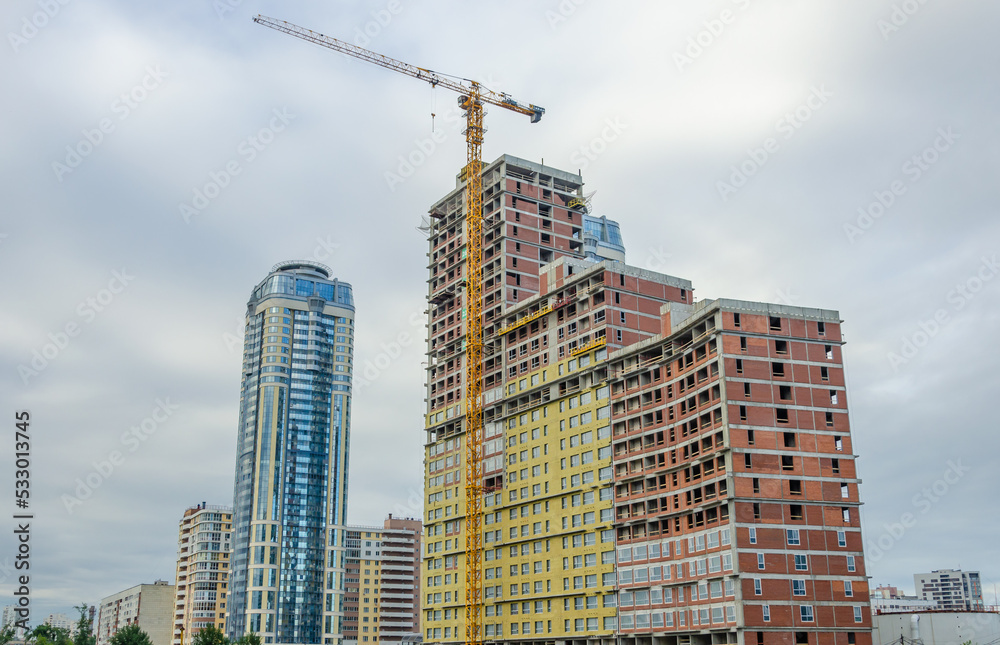 Construction of a high-rise building using a tower crane