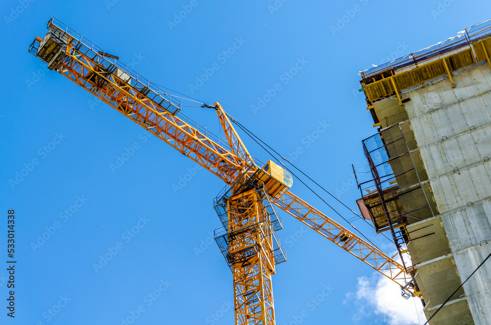 We are building a house with a tower crane.