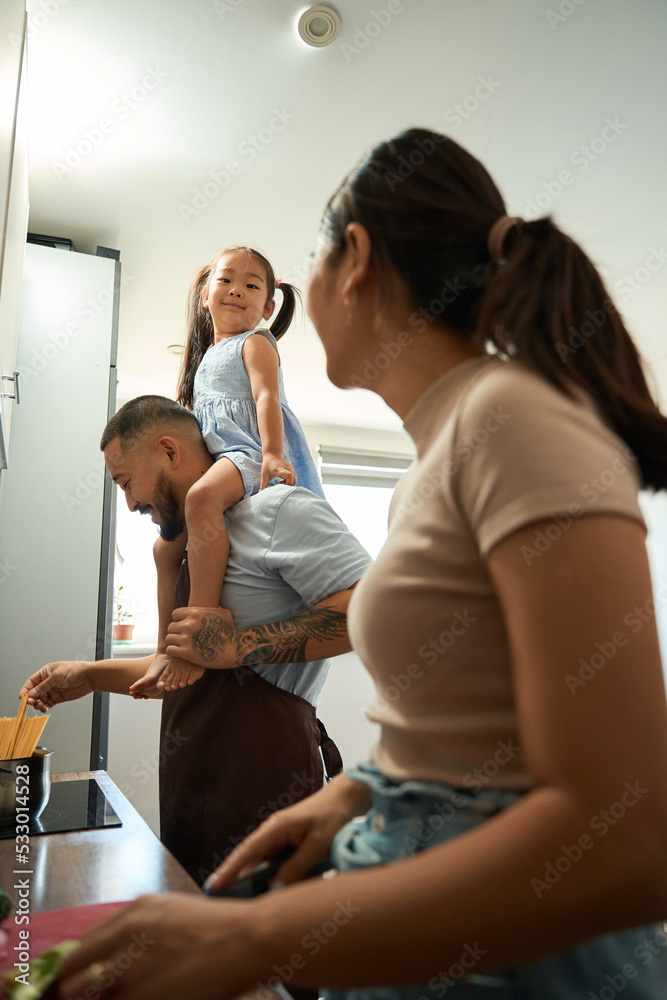 Daughter sits proudly on the shoulders of her father Daughter sits proudly on the shoulders of her father