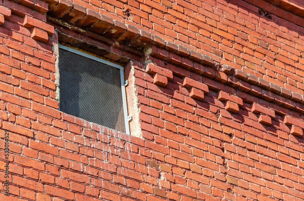 Fototapeta premium An old brick building with windows.