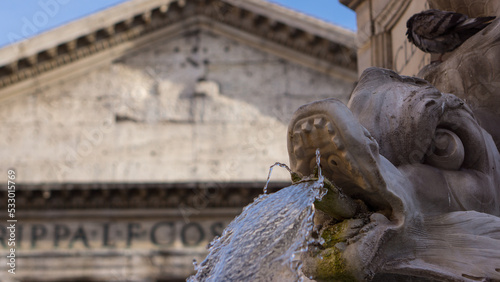 The fountain outside Rome’s Pantheon, nestled in Piazza della Rotonda, features ornate marble sculptures and an ancient Egyptian obelisk. Designed in the Baroque style, it blends elegance with history