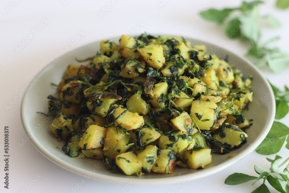 Aloo Methi. A sauteed potato side dish with fresh fragrant fenugreek leaves which is commonly known as methi leaves and spices