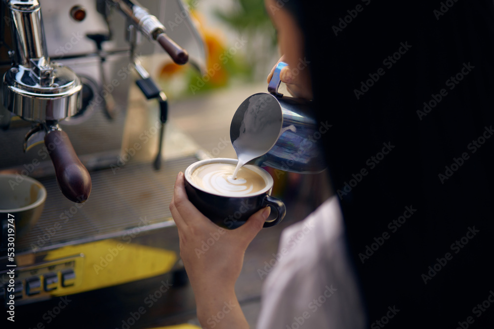 men's hands pouring milk and preparing fresh cappuccino, coffee pot and cooking concept, morning coffee men's hands pouring milk and preparing fresh cappuccino, coffee pot and cooking concept, morning coffee
