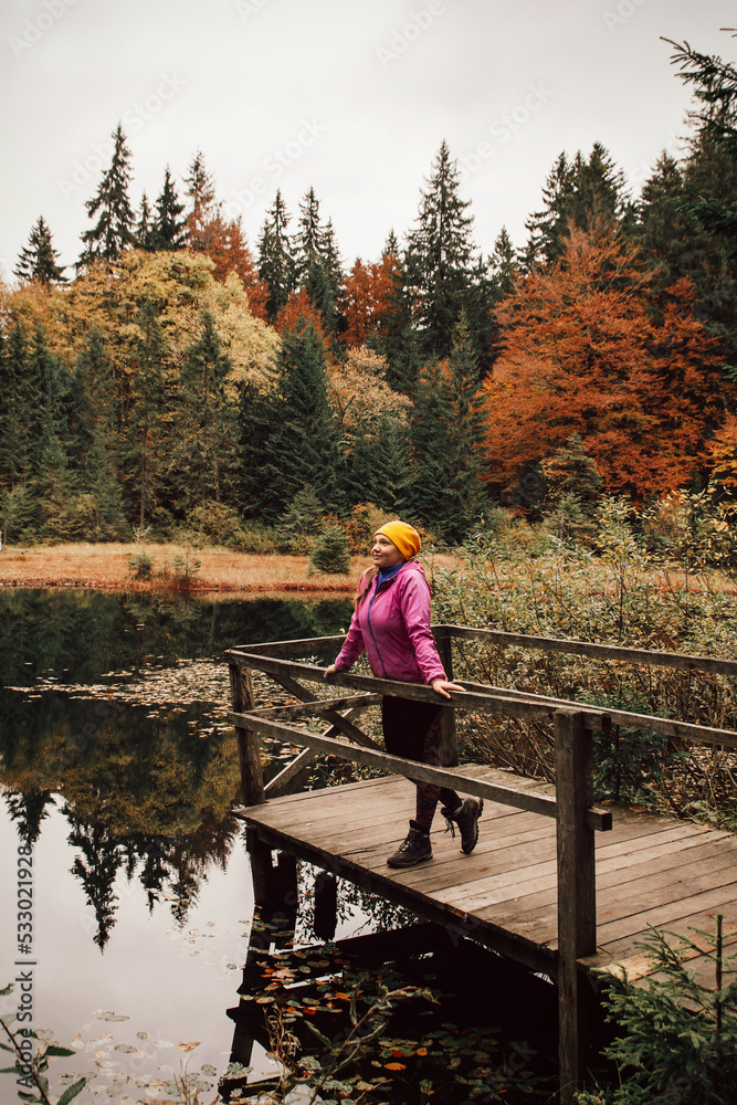 Young traveler hiking girl with backpacks. Hiking in mountains. Sunny landscape. Tourist traveler on background view mockup. Young traveler hiking girl with backpacks. Hiking in mountains. Sunny landscape. Tourist traveler on background view mockup.