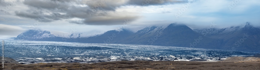 Iceland autumn tundra landscape near Haoldukvisl glacier, Iceland. Glacier tongue slides from the Vatnajokull icecap or Vatna Glacier near subglacial Esjufjoll volcano. Not far from Iceland Ring Road.