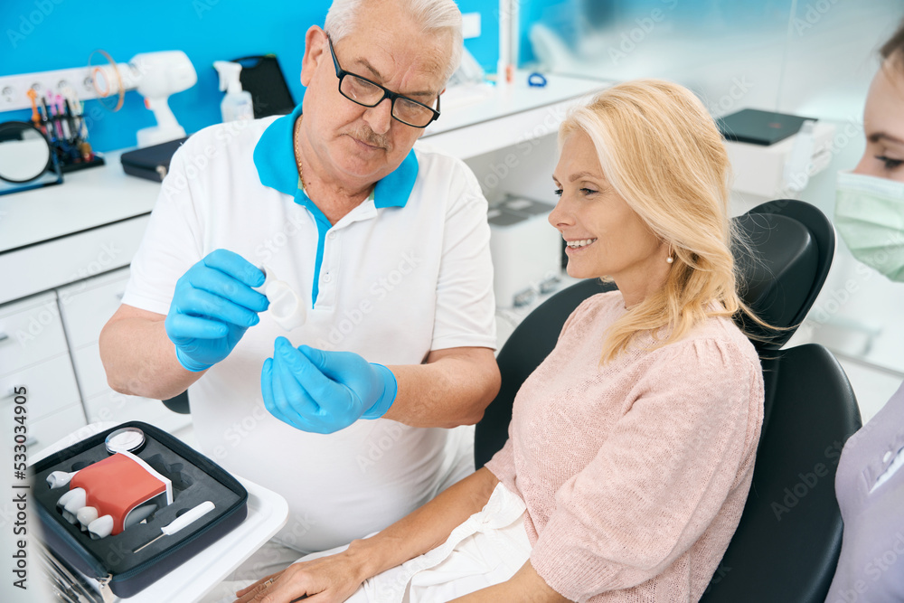 Patient on appointment with dentist in dental cabinet Patient on appointment with dentist in dental cabinet