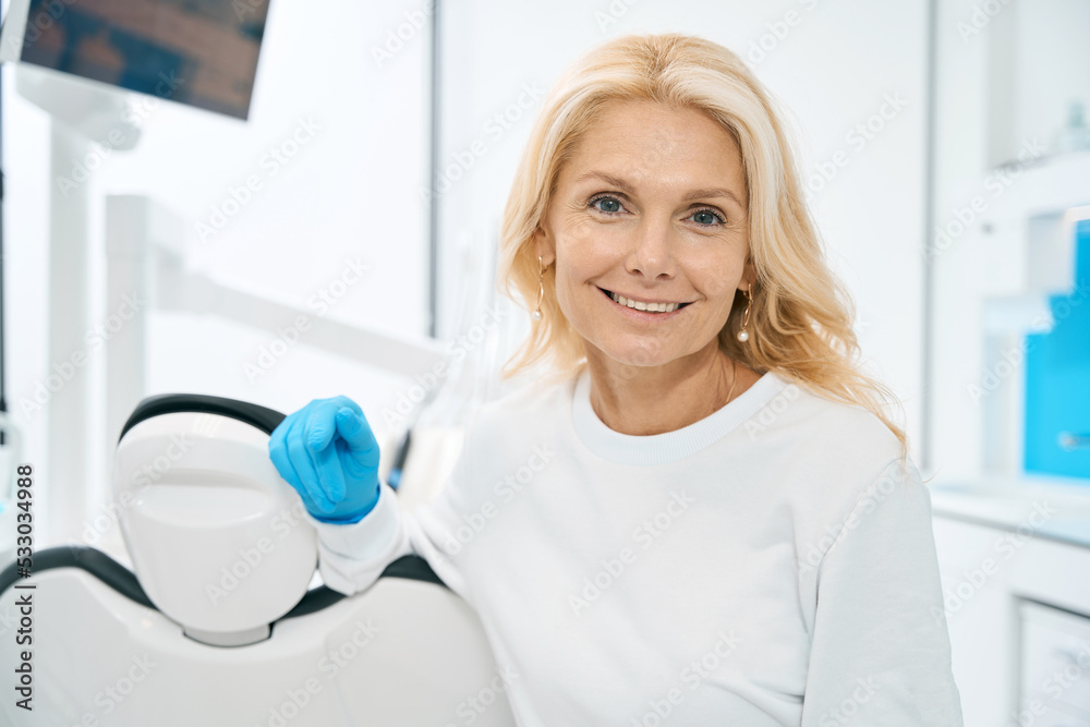 Female person waiting for patient in dental cabinet Female person waiting for patient in dental cabinet