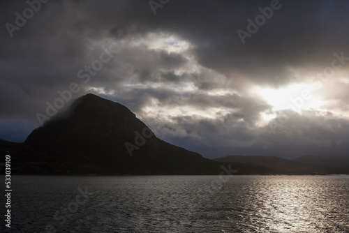 Dramatic sky over the mountain of Kunna from Støttfjorden, Meløy, Nordland, Norway