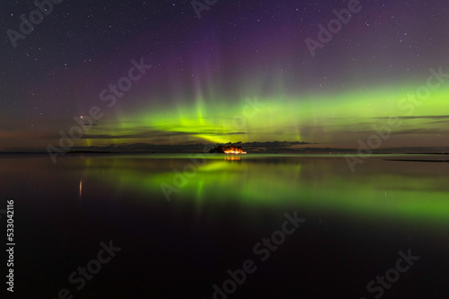 Northern lights and reflections in the water. Storsand, Jakobstad/Pietarsaari Finland