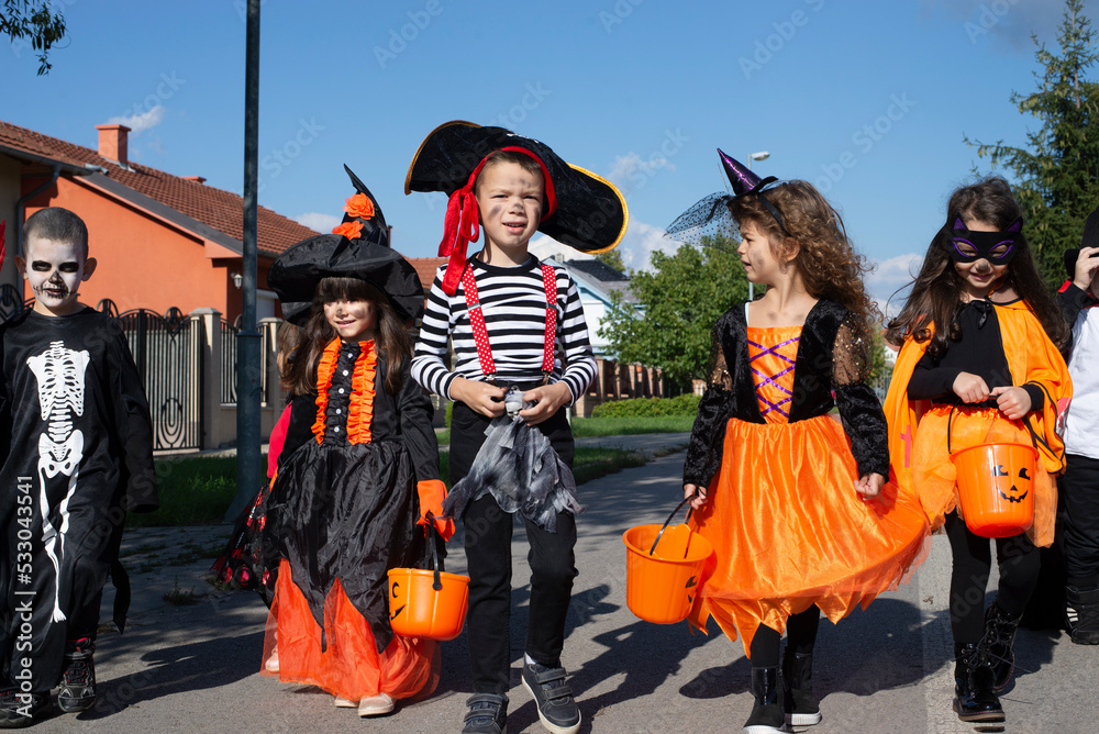 Kids trick or treat. Halloween fun for children.

