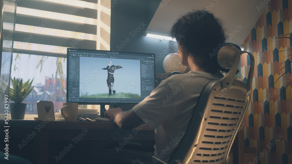 Male 3D designer sitting at the table at home and making animation for  video game character, using modern computer and software for creating 3D  modeling projects Stock Photo | Adobe Stock