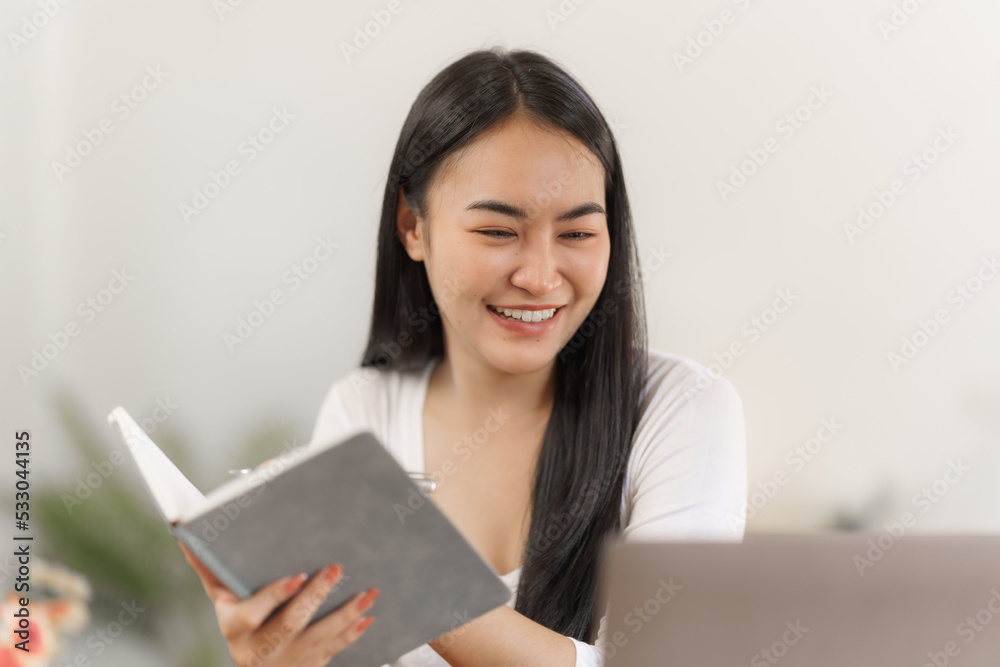 Happy smart asian woman freelancer working with laptop while live in the room. Happy smart asian woman freelancer working with laptop while live in the room.